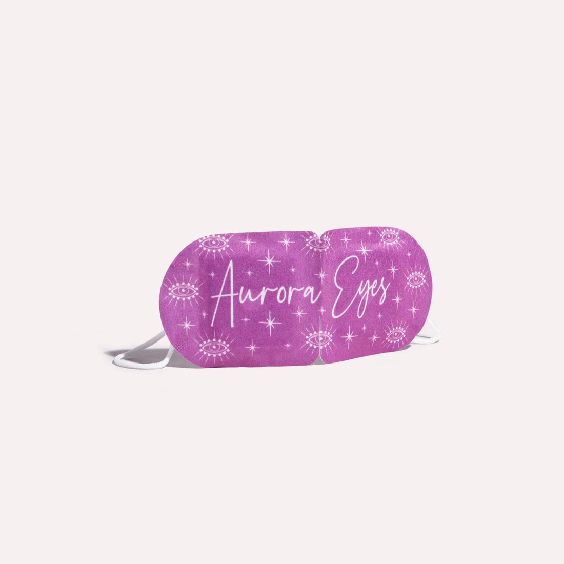 Aurora Eyes Self Heating Mask with white text, offering a soothing, fragrance-free experience with chamomile essence, ideal for stress relief and eye relaxation.
