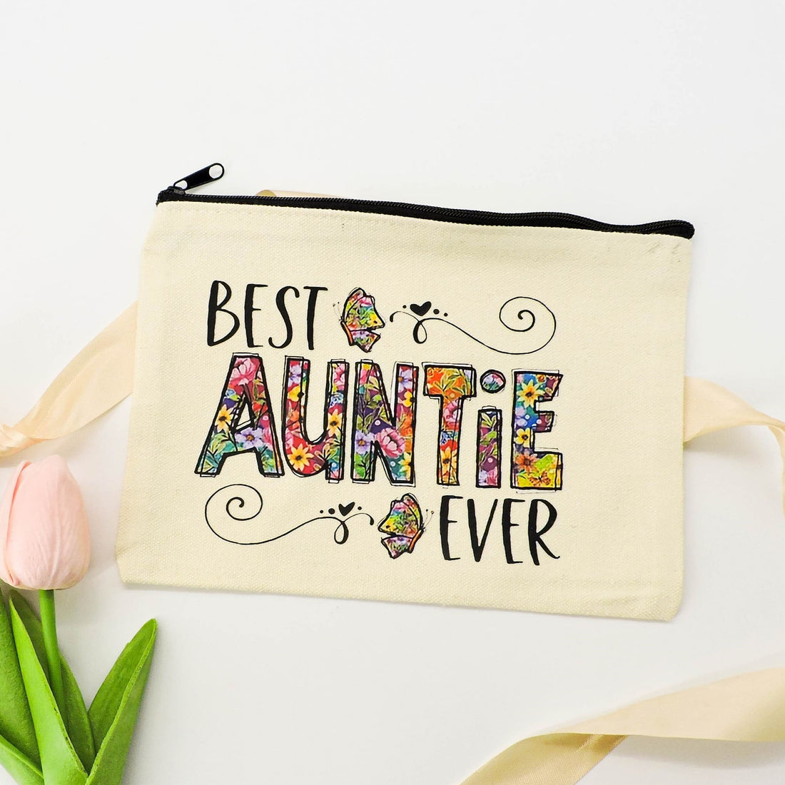 Best Auntie Ever Pouch with floral design, featuring a zippered closure, perfect for storing makeup or essentials.