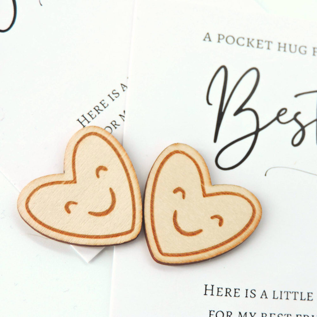 Bestie Pocket Hug: A close-up of a smiling, heart-shaped wooden token, carved to bring warmth and comfort, ideal for gifting to a friend.