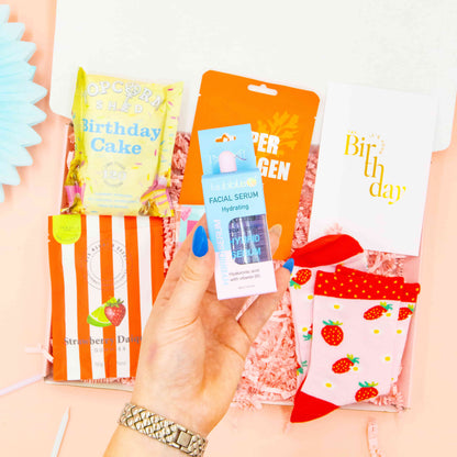 Fun birthday gift for her – cosy strawberry socks, pampering mask, and chocolate spoon