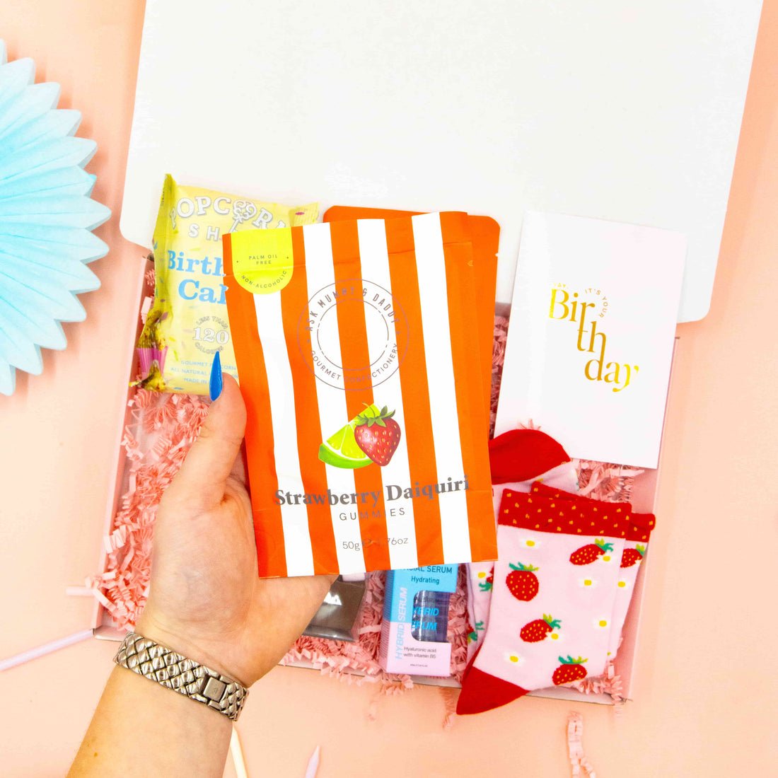 Birthday gift box for her – fun birthday socks, collagen mask, and sweet treats
