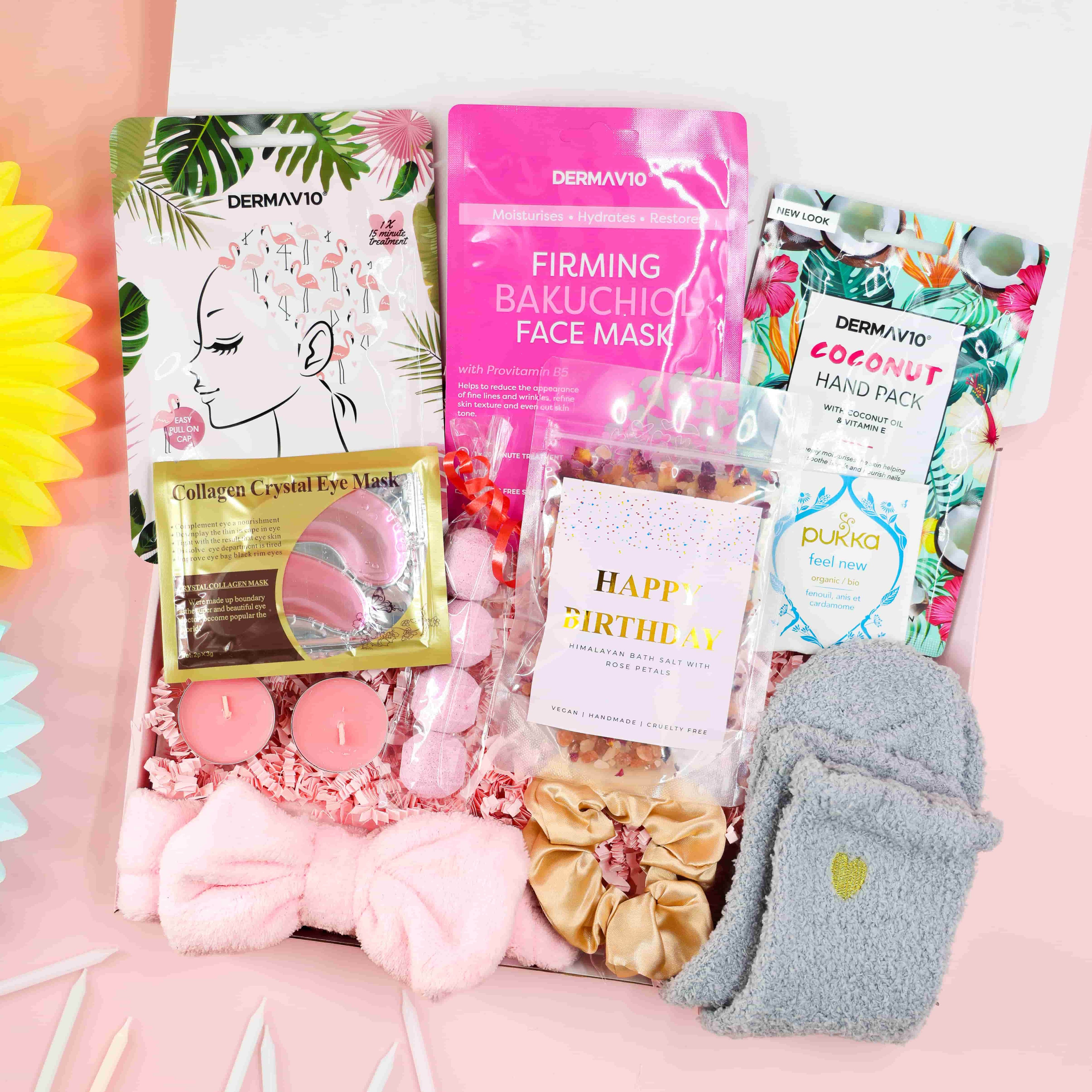 Birthday Spa Day in a Box gift set with pink headband, cosy grey socks, bath salts, tropical hair mask, firming face mask, coconut hand pack, candles, and Pukka tea – luxury birthday pamper gift for her