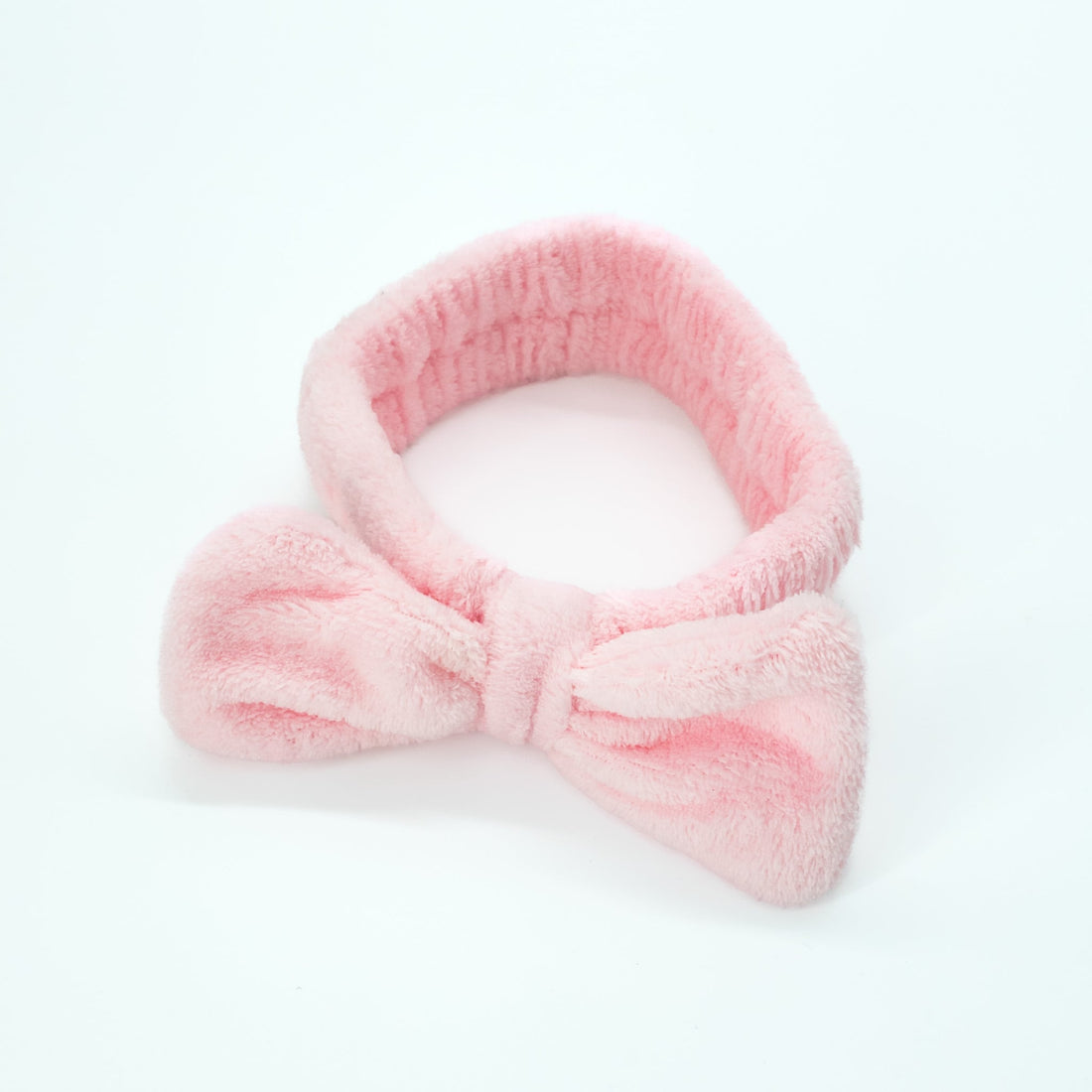 Bowknot Headband Pink: A plush headband with a stylish bowknot, ideal for securing hair during beauty routines, blending functionality with charm.