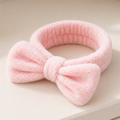 Bowknot Headband Pink: A plush headband with a stylish bowknot, ideal for securing hair during beauty routines, blending functionality with charm.