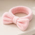 Bowknot Headband Pink: A plush headband with a stylish bowknot, ideal for securing hair during beauty routines, blending functionality with charm.