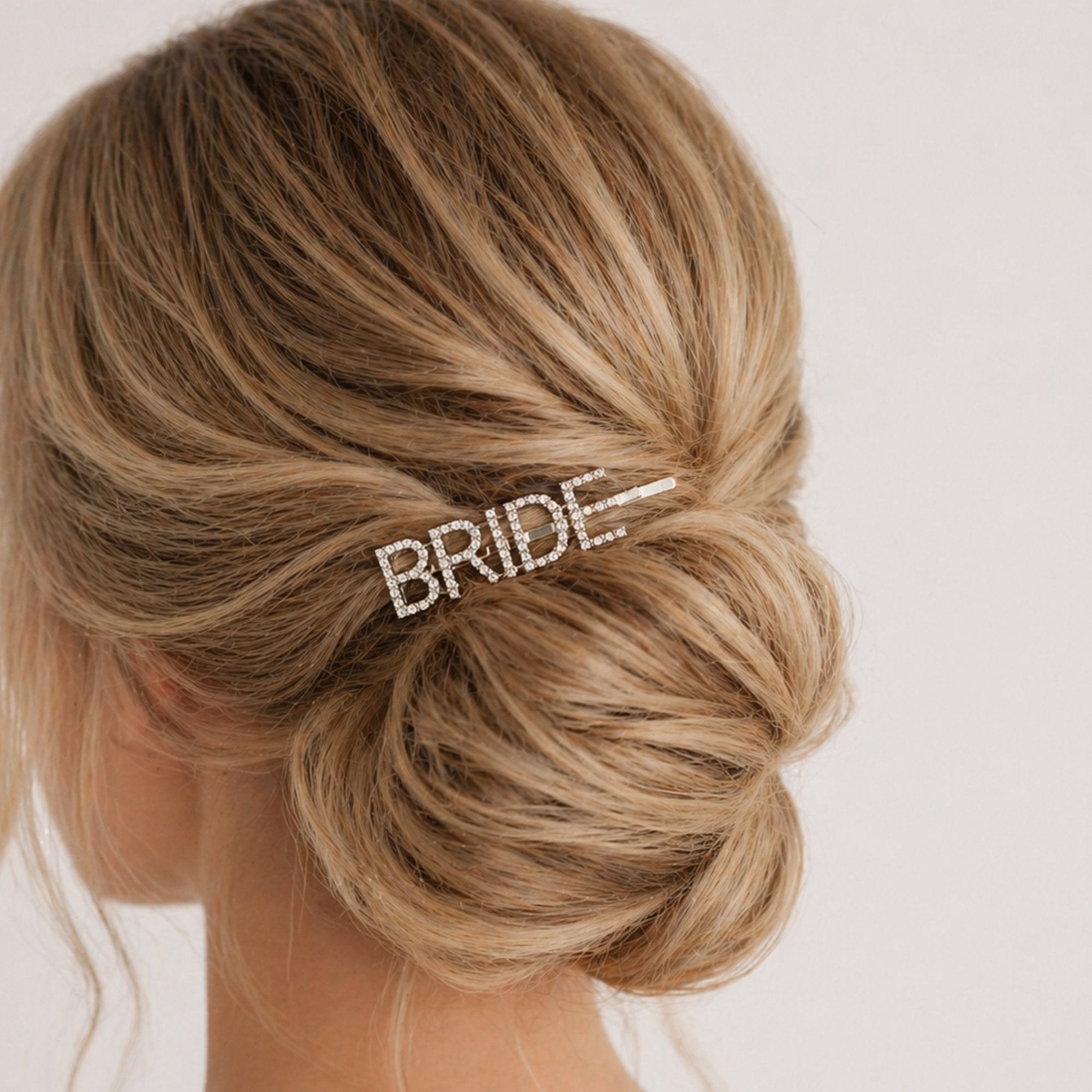 Model wearing Bride Rhinestone Hair Clip, a sparkling fashion accessory, perfect for pre-wedding events, enhancing bridal celebrations with elegance and charm.
