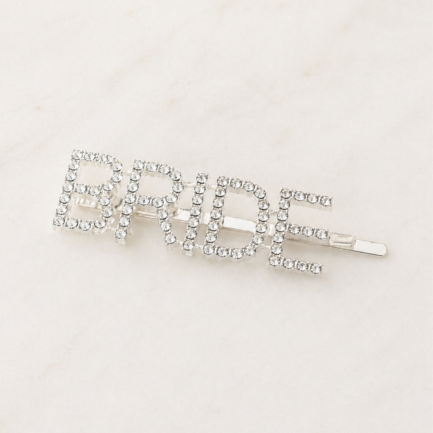 Bride Rhinestone Hair Clip: A sparkling silver hair accessory adorned with rhinestones, ideal for bridal showers and pre-wedding celebrations, adding elegance and charm to her special day.