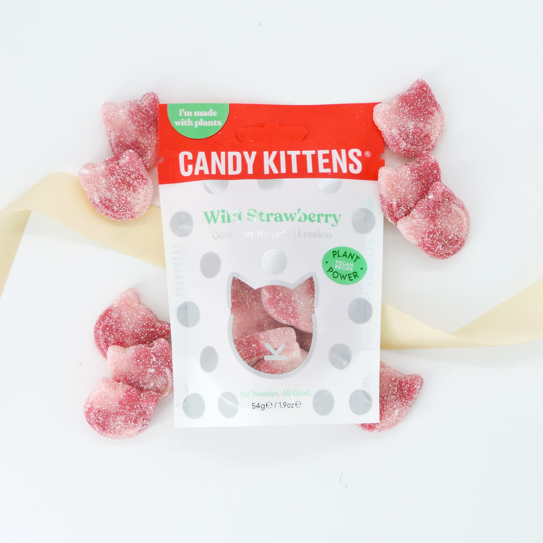 Candy Kittens Wild Strawberry Sweets, gourmet plant-based candies, chewy texture, displayed with visible product labels emphasizing natural ingredients and London origin.