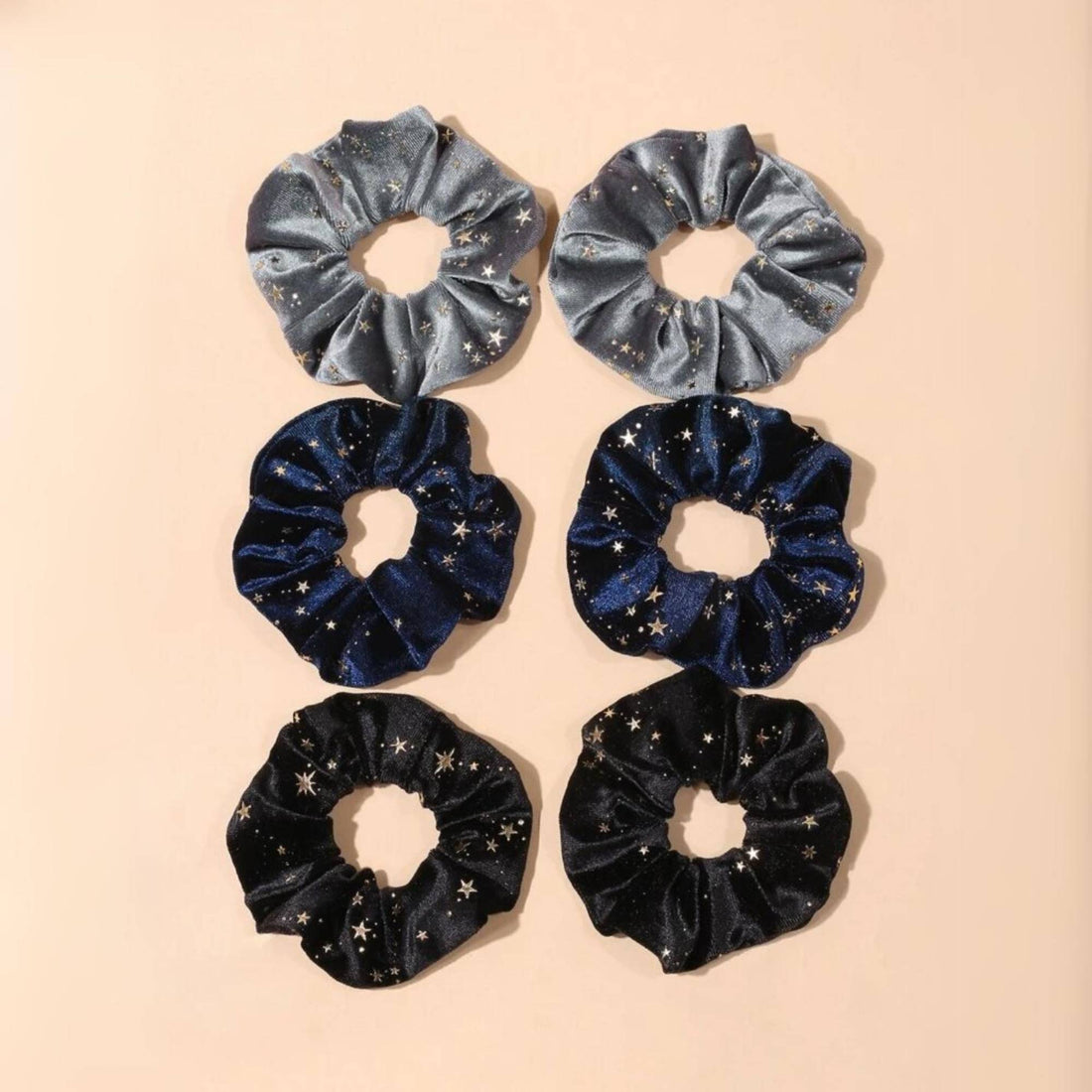 Celestial Velvet Scrunchie Set - 6 Pieces features luxurious velvet scrunchies with shimmering stars, perfect for adding celestial charm to hairstyles or wrist wear.