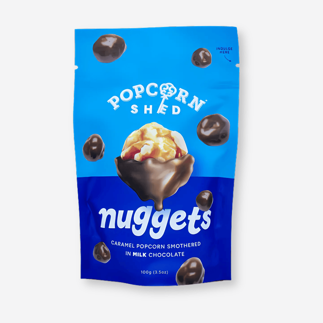 Popcorn Shed Chocolate-covered Caramel Popcorn: Close-up of popcorn coated in milk chocolate, bag showing popcorn bowl image, ideal indulgence for gifting, sharing, or personal treat.