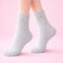 Cosy Heart Print Socks - Grey, featuring fluffy texture and subtle gold heart details, perfect for warmth and comfort at home or as a heartfelt gift.