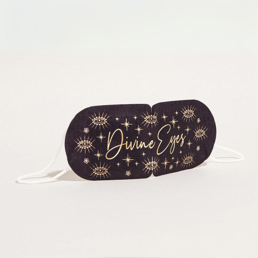 Divine Eyes Self-Heating Mask with gold text, offering soothing lavender-scented warmth for relaxation and tension relief, ideal for tired eyes and stress reduction.