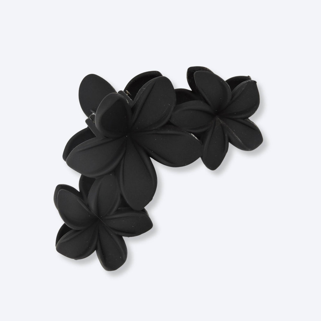 Floral Hair Clip - Black: A close-up of an elegant black hair clip featuring a unique flower design, ideal for enhancing any hairstyle with sophistication.