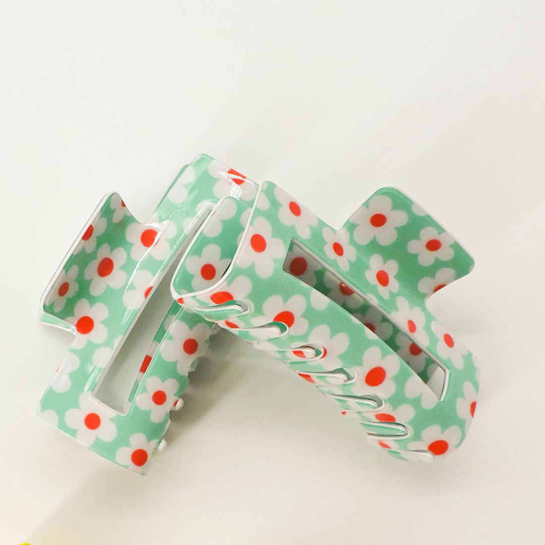Flower Print Hair Clip showcasing a stylish floral pattern, perfect for an elegant hairstyle with secure grip, ideal for chic hair styling.