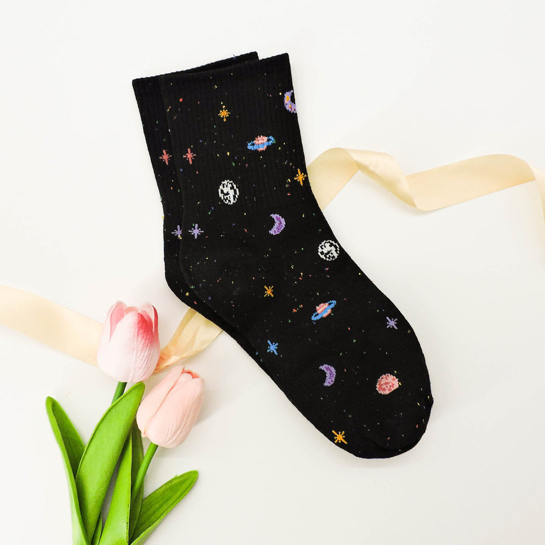 Galaxy Print Socks featuring a playful celestial design, blending cosmic motifs with cozy material, perfect for adding a space-inspired touch to outfits.