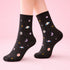 Galaxy Print Socks featuring a playful celestial design, blending cosmic motifs with cozy material, perfect for adding a space-inspired touch to outfits.