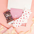 get well soon gift – small pink treat box with cosy socks and chocolate brownie bar