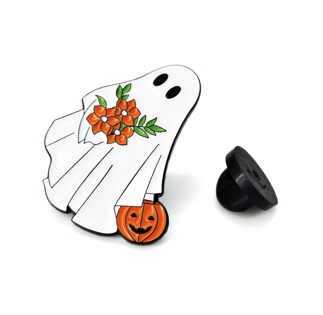 Ghost Pin with pumpkin and floral accents, perfect for adding Halloween charm to your attire or accessories. Festive and playful collectible item.