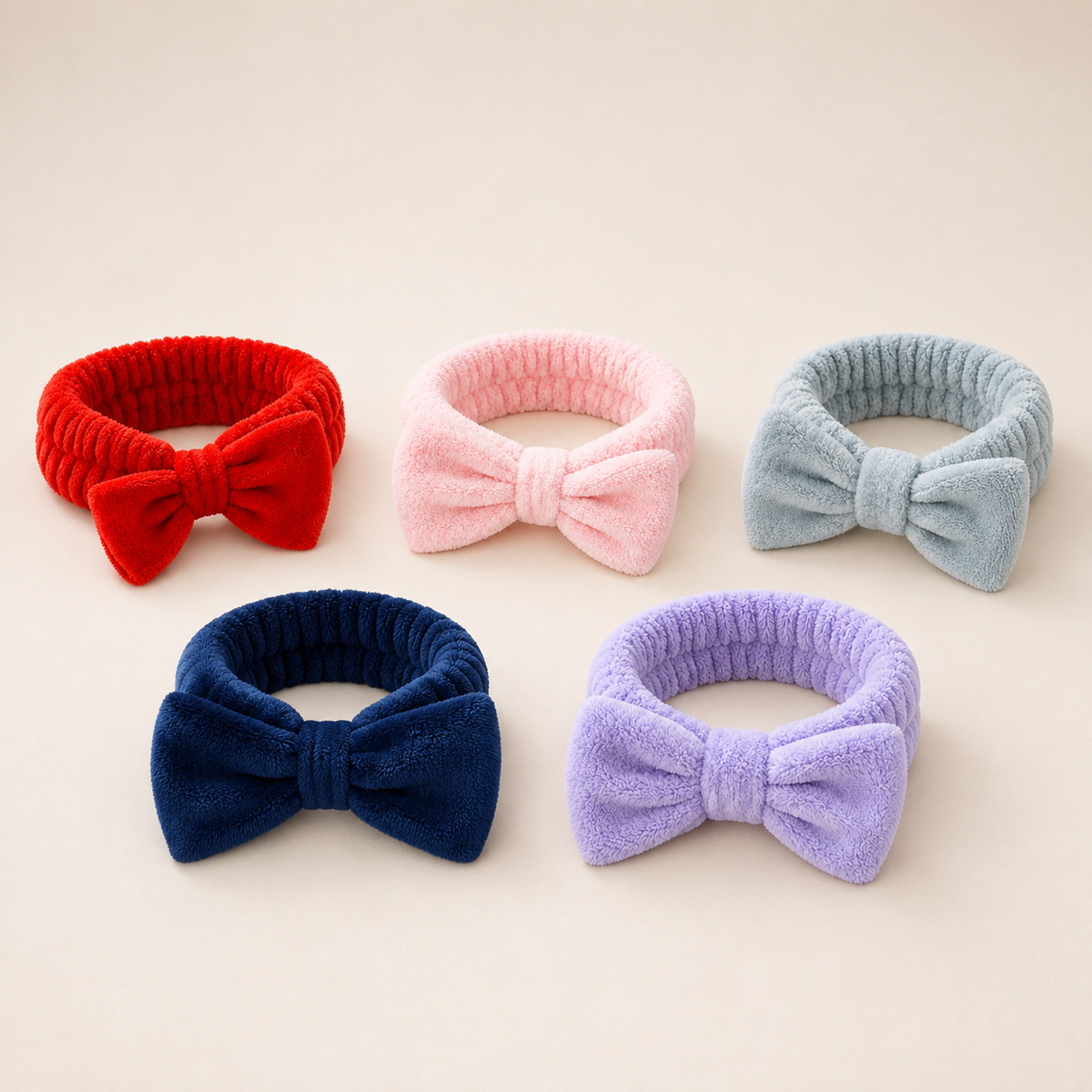 Gifts for her featuring plush bowknot headbands shown in a selection of available colours.