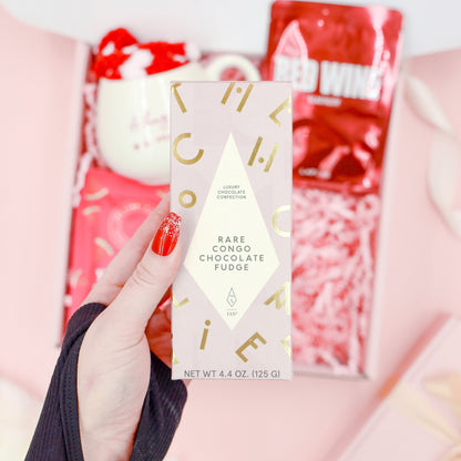 Red Velvet Treats exclusive luxury gift for her with Rare Congo chocolate fudge, red wine face mask, mug, cosy socks and self-care treats.