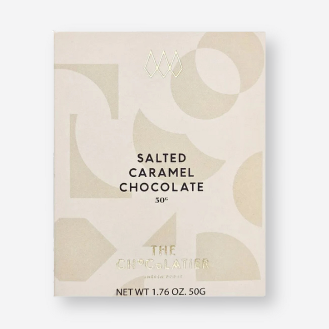 The Chocolatier Salted Caramel Chocolate bar in elegant cream packaging with abstract shapes and pale gold ribbon, perfect for gifting and indulgence.