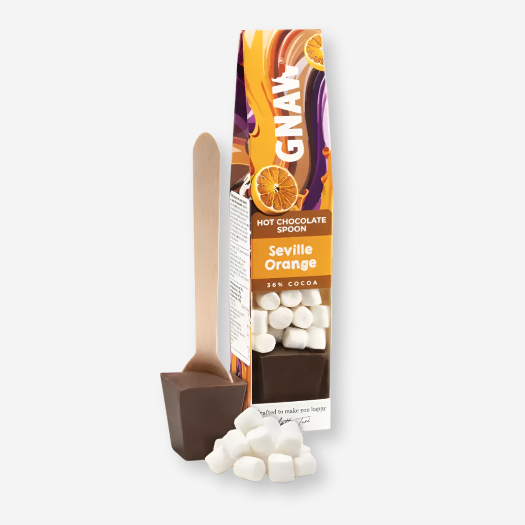 Gnaw Caramel Hot Chocolate Spoon with mini marshmallows, designed to melt into warm milk for a creamy, caramel-flavored hot chocolate experience.