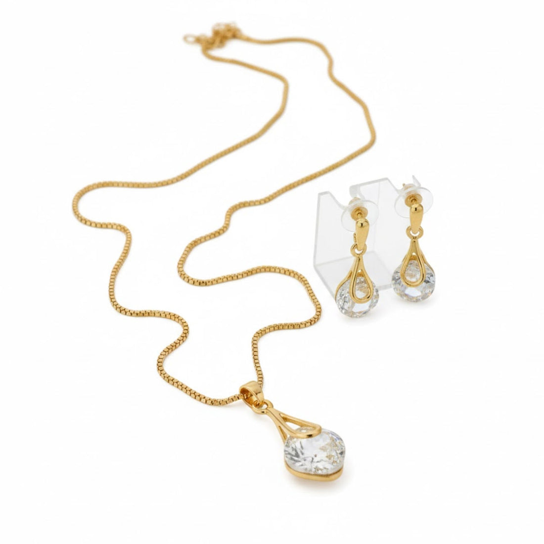 Gold-Plated Crystal Pendant Jewelry Set featuring a close-up of a radiant gold chain and sparkling diamond earrings, ideal for special occasions or cherished gifts.