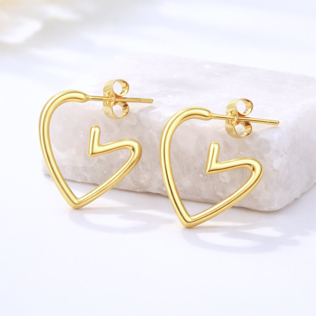 Gold Heart Earrings Charm with sleek open-heart design and hook fastening, offering a chic, elegant touch for gifting or everyday wear.