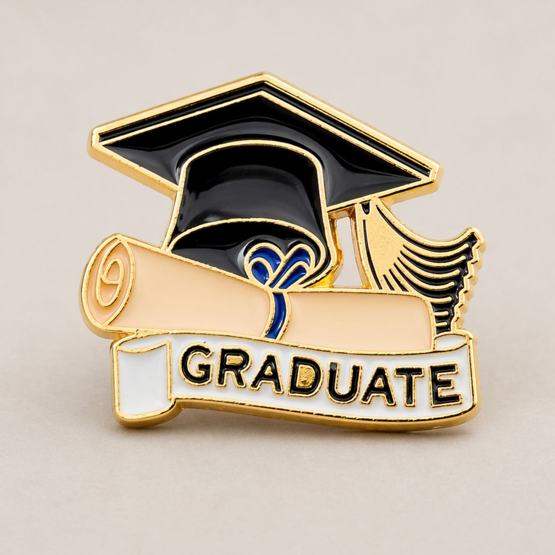 Graduate Pin featuring a detailed graduation cap and diploma design, symbolizing academic achievement. A perfect keepsake for new graduates.