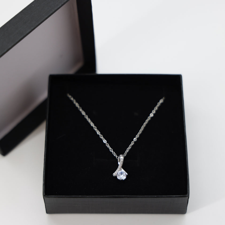 Graduation Day Necklace, featuring a teardrop crystal pendant on a delicate silver chain, elegantly gift-boxed for a memorable milestone celebration.
