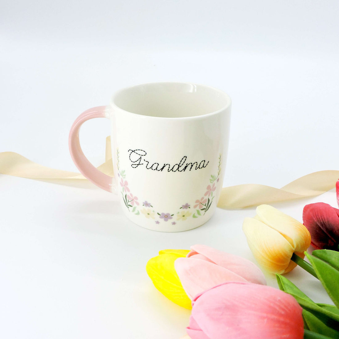 Grandma Ceramic Mug with a floral design and pink handle, showcasing its elegant serveware style, ideal as a timeless keepsake for grandmothers.