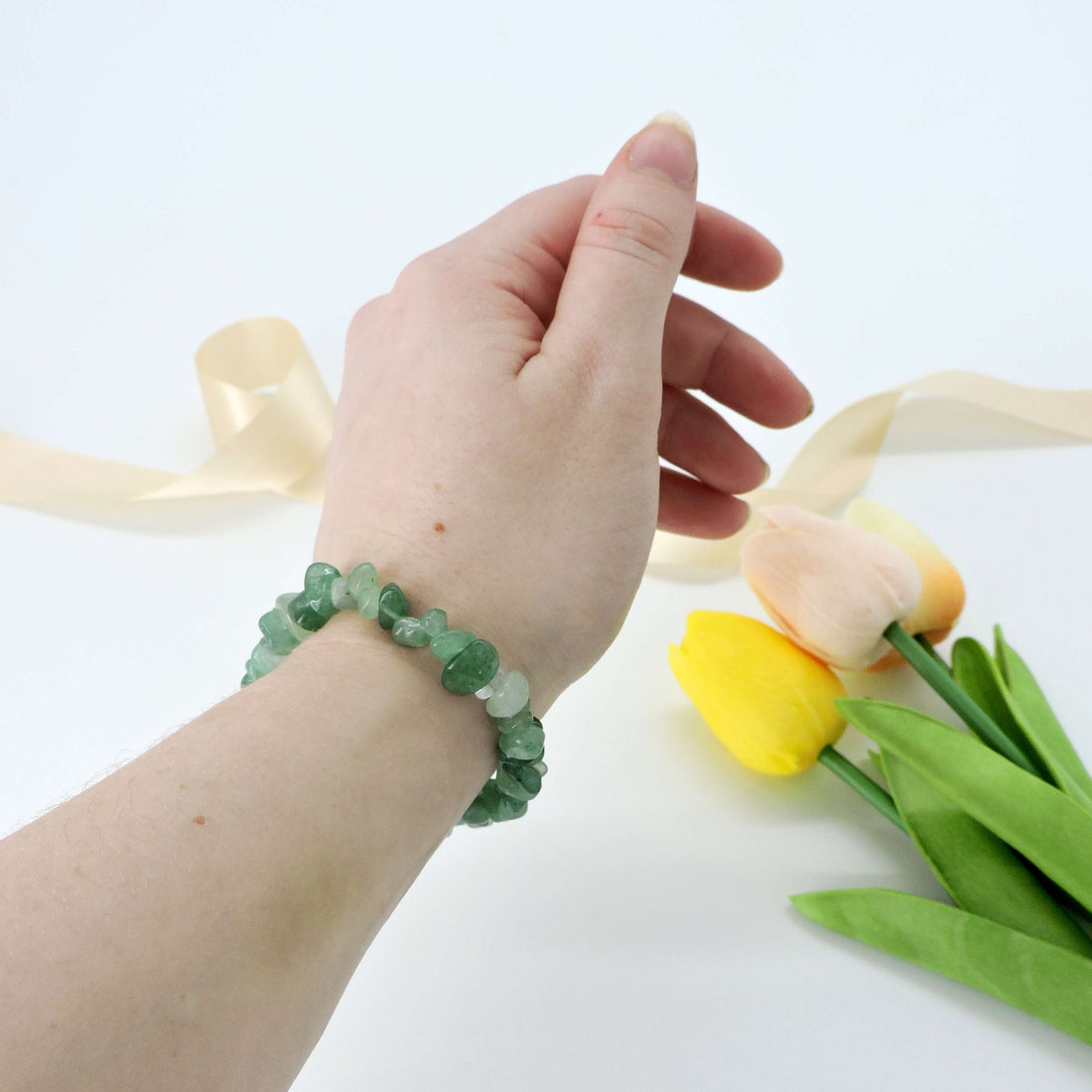 Close-up of the Aventurine Crystal Chip Bracelet, adorned with natural aventurine chips, showcasing its elegant design, perfect for everyday wear and holistic wellness.