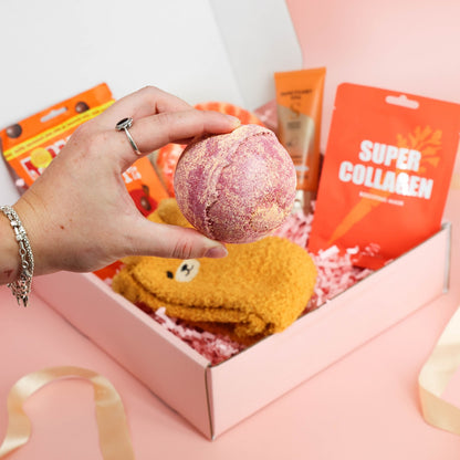 hug in a box – bright orange pamper box filled with cosy, sweet and relaxing surprises
