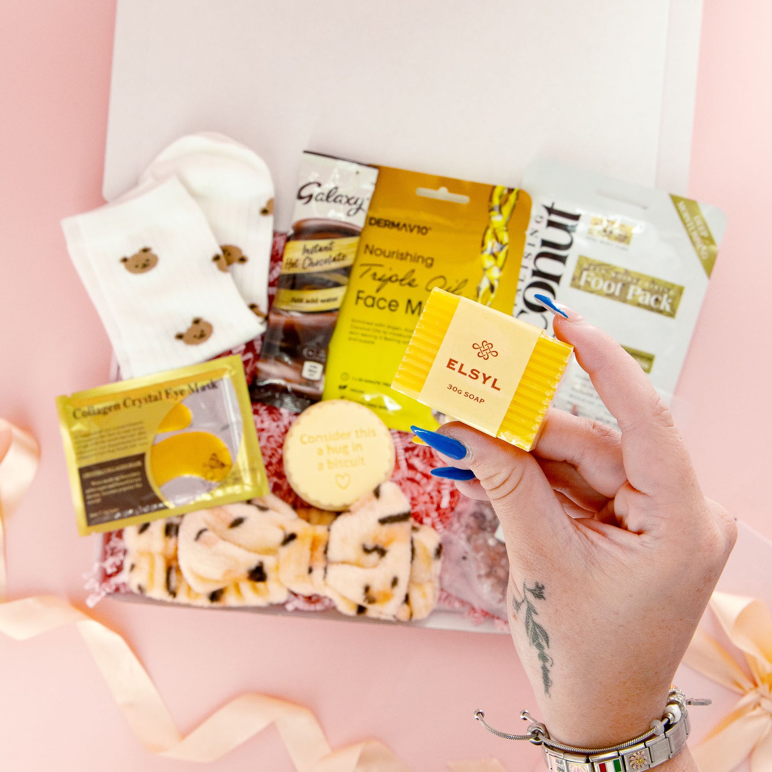 Pampering self care gift for her with natural soap, comfort socks, biscuit treat and skincare essentials – the perfect gift for women who need a boost.