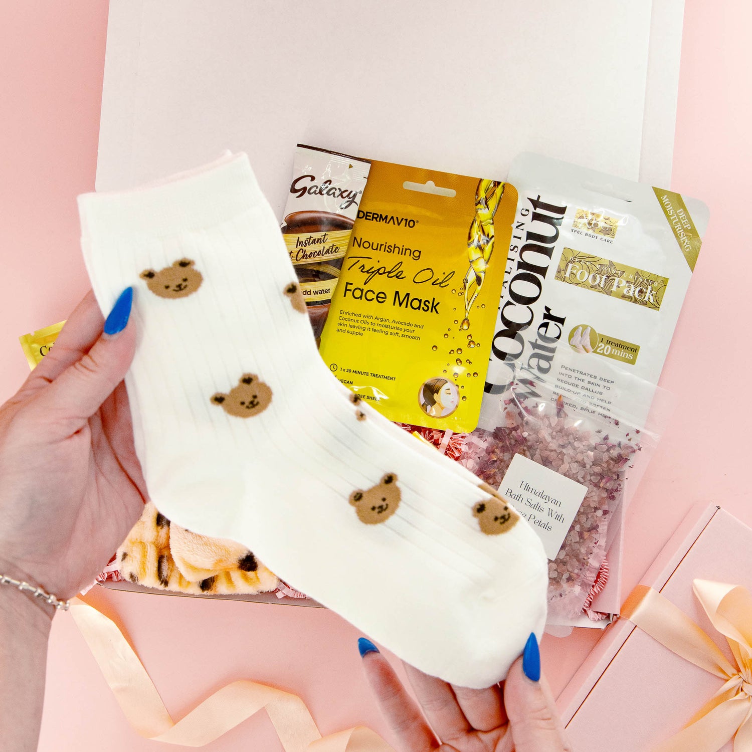 Cute self care gift box with bear print socks, face mask, bath soak and chocolate – a comforting and thoughtful gift for her.