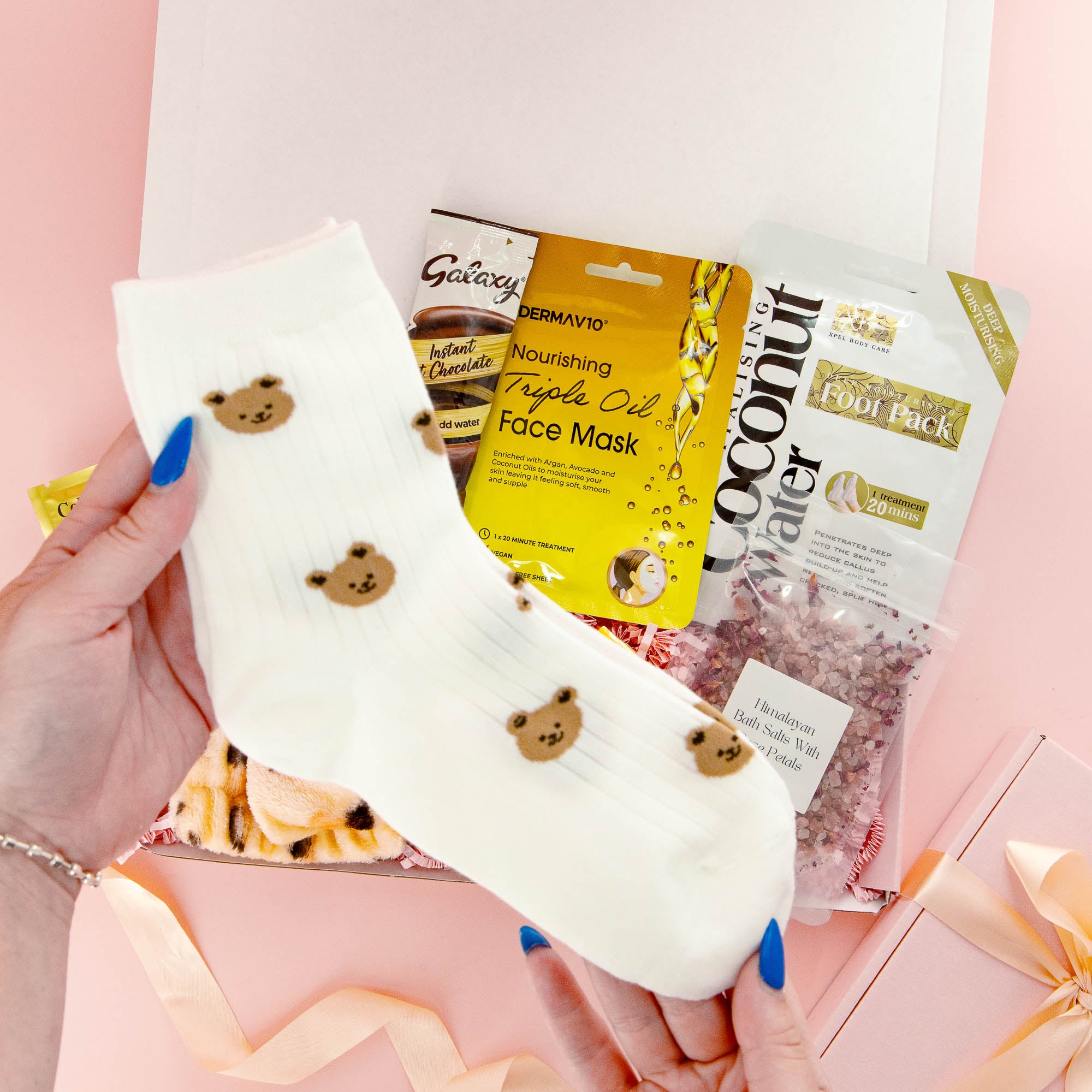 Cute self care gift box with bear print socks, face mask, bath soak and chocolate – a comforting and thoughtful gift for her.