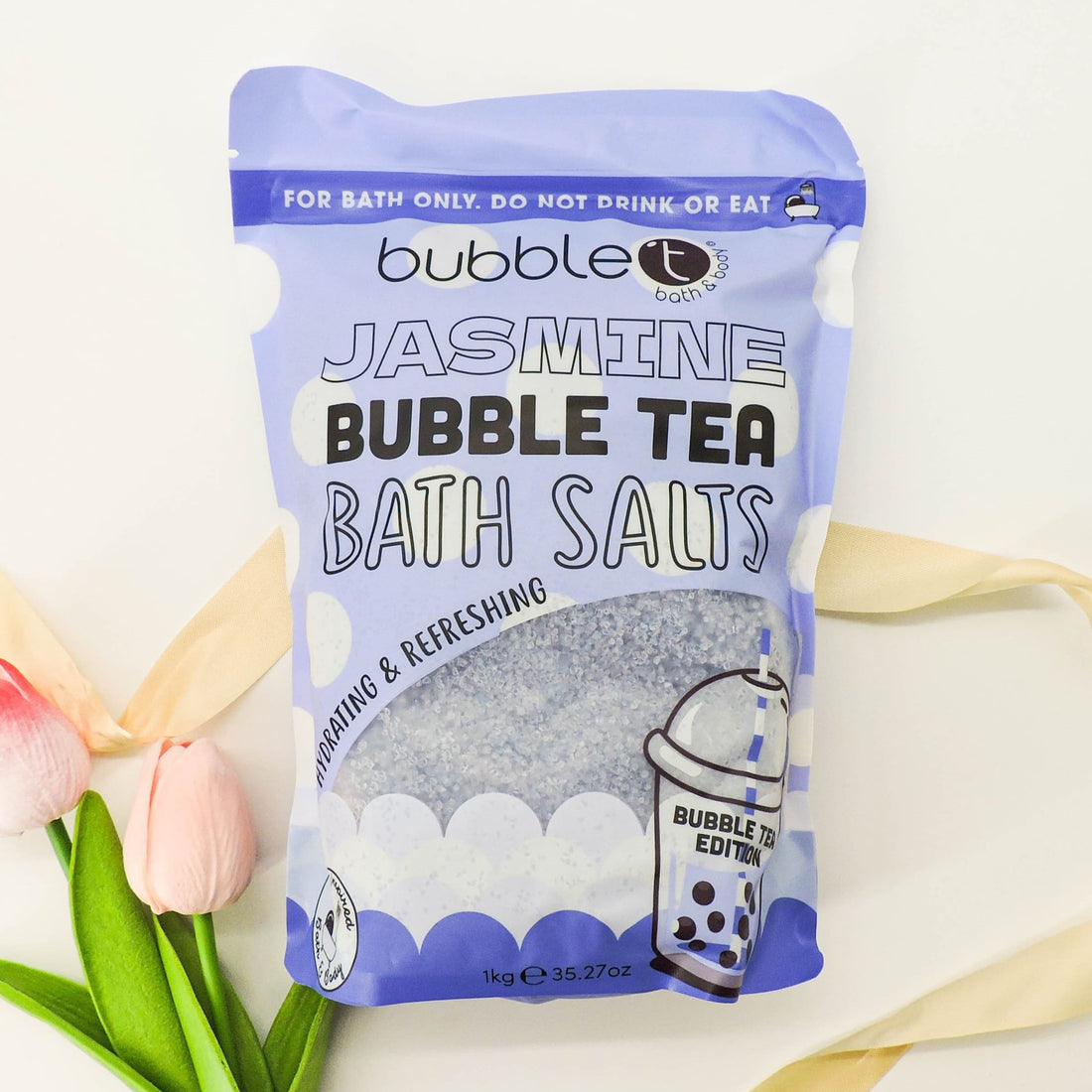 Jasmine Bubble Tea Bath Salts with soothing jasmine extracts, featuring a close-up of a floral logo and packaging, ideal for relaxation and skin hydration.
