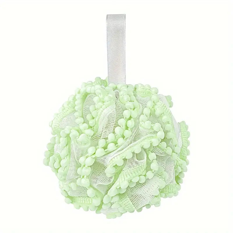Close-up of the Luxury Loofah - Lime, showcasing its fine mesh texture, designed for gentle exfoliation and a luxurious lathering experience.