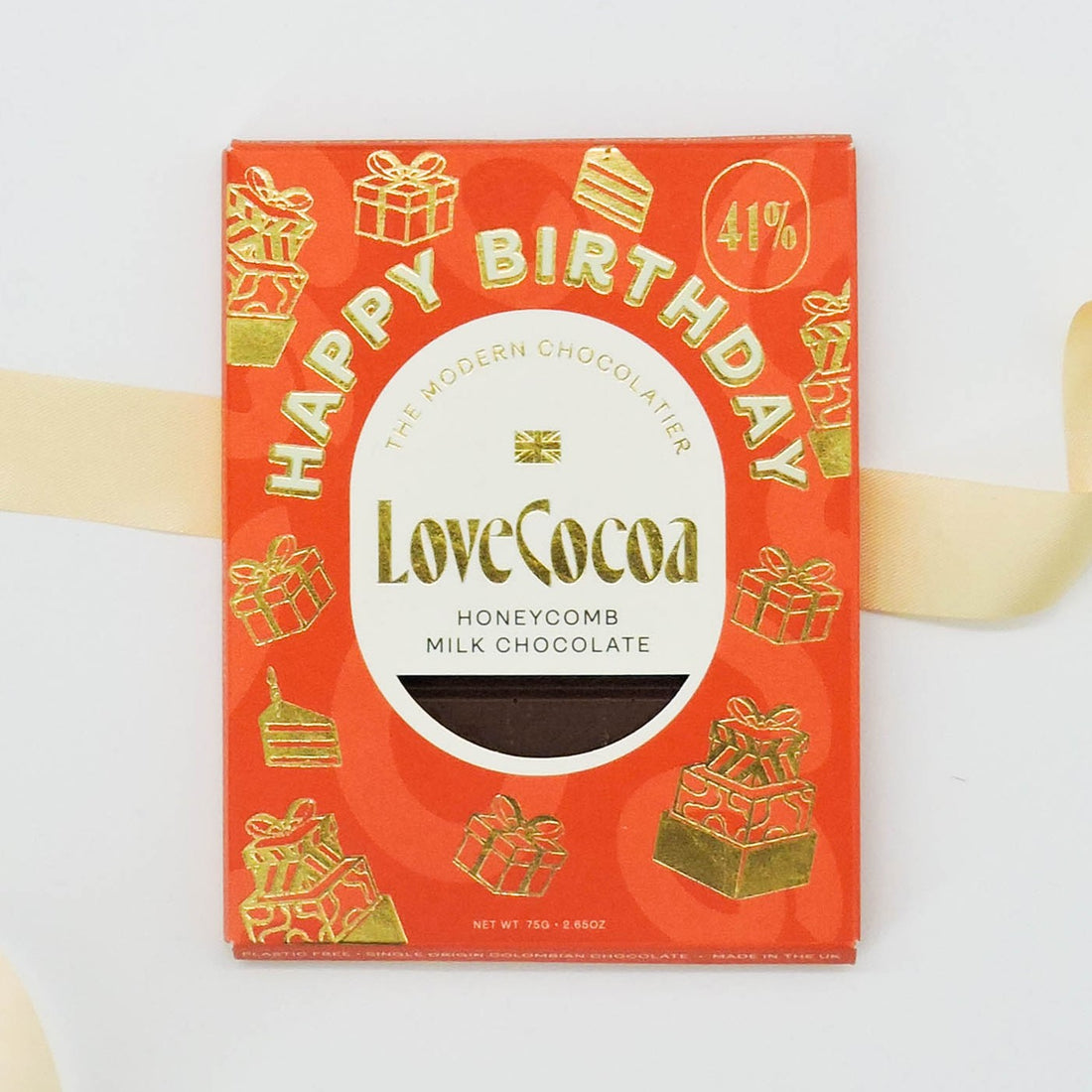 Love Cocoa Happy Birthday Chocolate bar, featuring a red and gold sleeve with a smooth Colombian milk chocolate and honeycomb flakes inside.