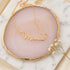 Mama Necklace with Heart: A close-up of a gold necklace featuring a Mama pendant and a delicate heart charm, symbolizing love and appreciation for mothers.