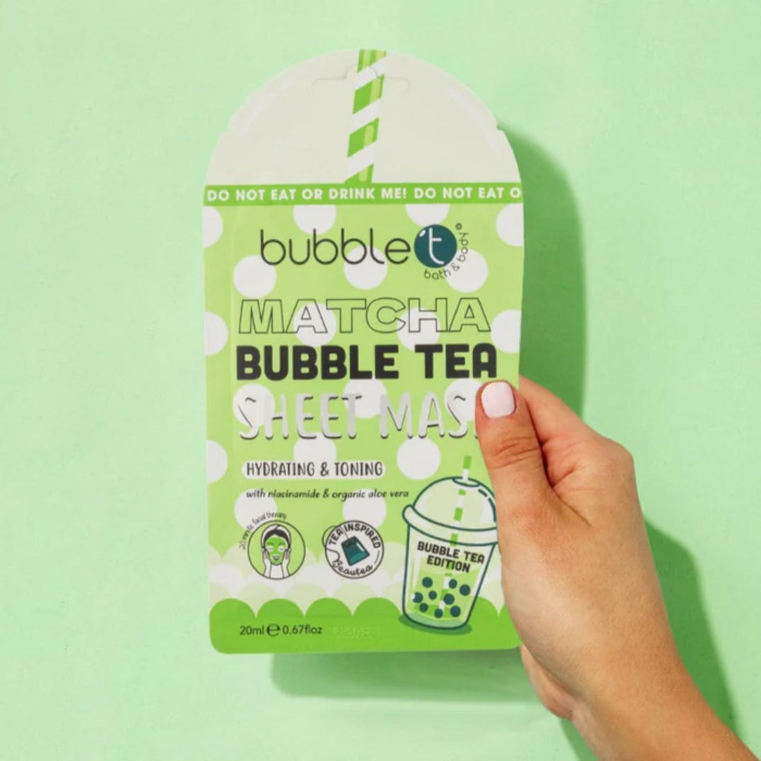 Hand holding a package of Matcha Face Mask - Hydrating &amp; Toning, enriched with aloe vera and niacinamide, perfect for at-home spa treatments.