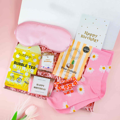 Pina Colada Birthday gift box for her with daisy socks, tropical mask, birthday candle, claw clip and pamper treats – perfect birthday hamper for her