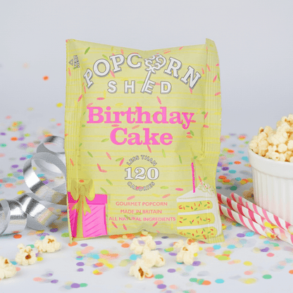 Birthday Cake Popcorn Bonanza, a festive snack featuring popped corn with sugar strands and white chocolate, perfect for celebratory occasions. Vegetarian-friendly ingredients.