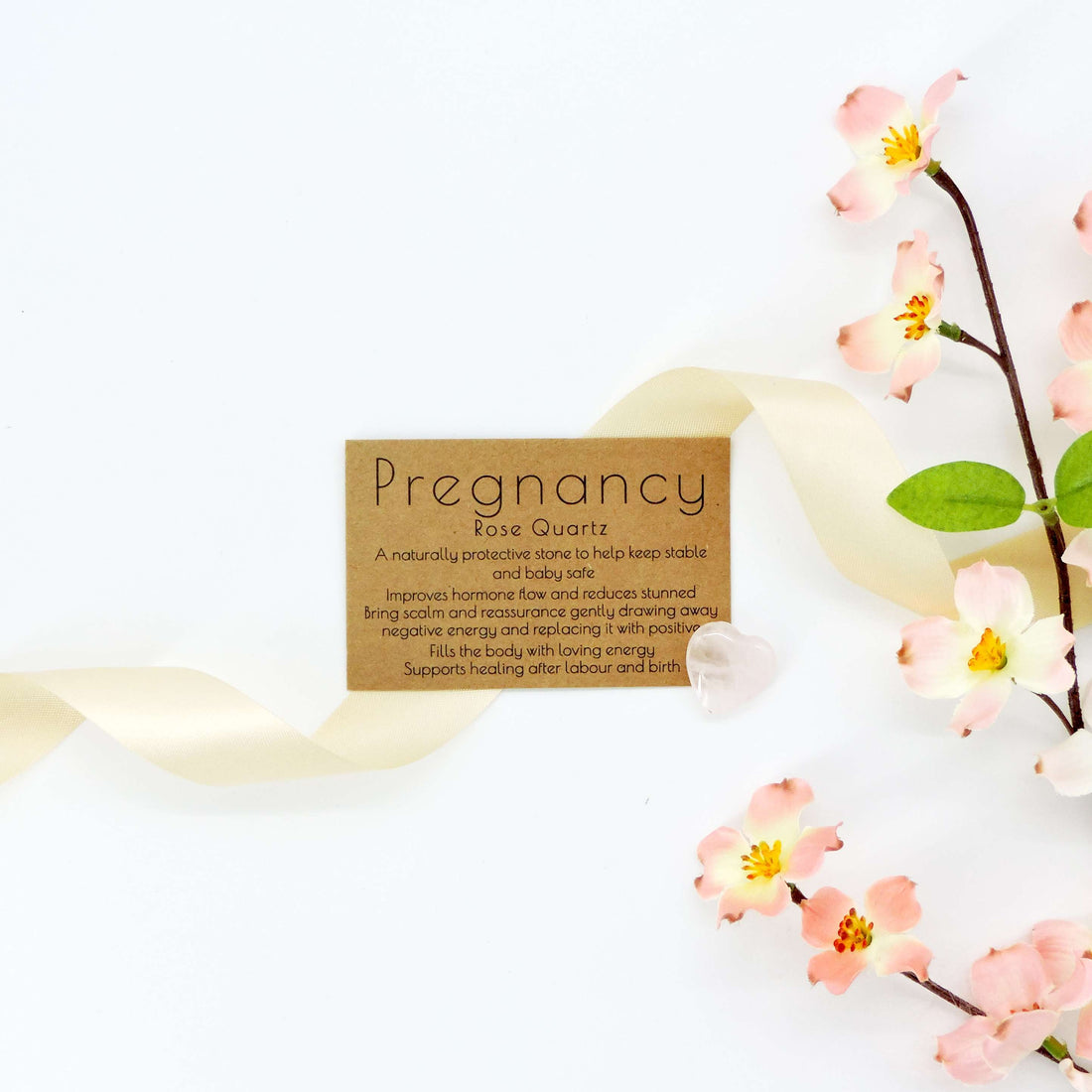 Pregnancy Rose Quartz Crystal, a nurturing stone for expectant mothers, is depicted here with close-up floral motifs, symbolizing calm and positive energy.