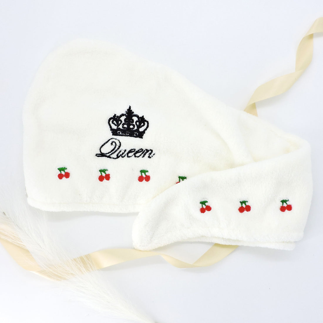 Queen Embroidered Hair Towel with crown and cherry motifs, ultra-soft and absorbent, designed for hair protection and luxury self-care.