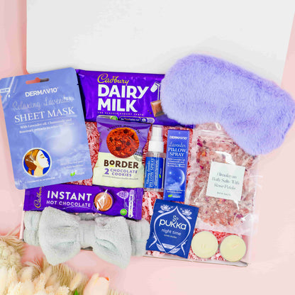 Rest and Recharge Gift Box – luxury pamper gift for her with lavender sheet mask, chocolate, bath salts, cookies, pillow spray, and cosy eye mask.