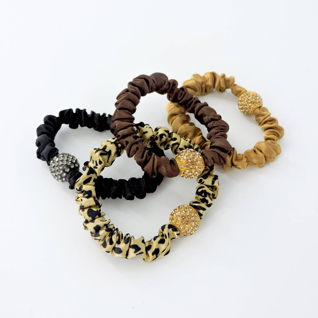 Rhinestone Leopard Hair Scrunchie - 4pcs: Close-up of chic animal print and rhinestone-accented hair ties, blending elegance with practicality for stylish hairstyles.