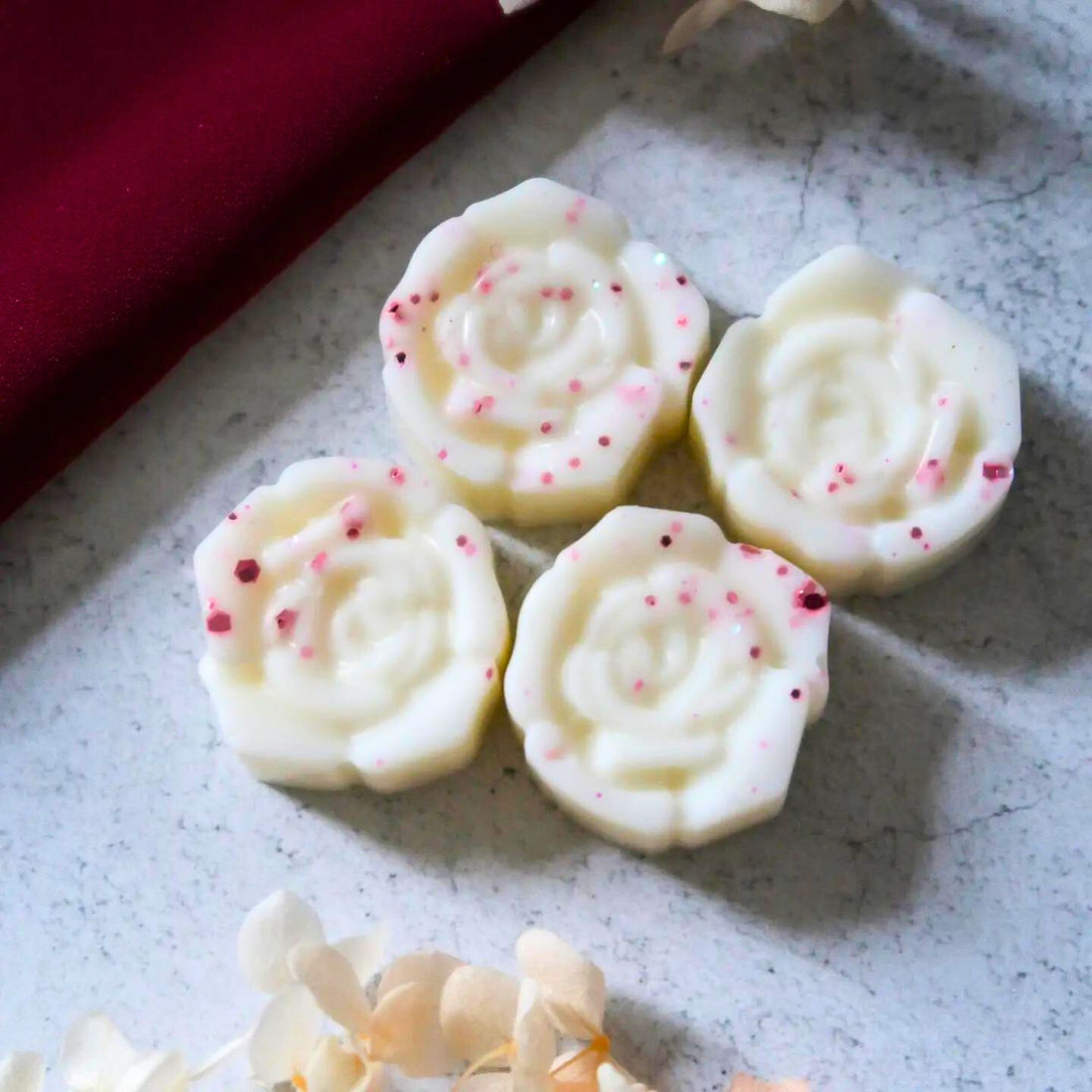 Rose Oud Wax Melt elegantly packaged, showcasing luxurious soy wax pieces. Perfect for enhancing gift boxes with its rich, oriental floral fragrance and sophisticated scent profile.