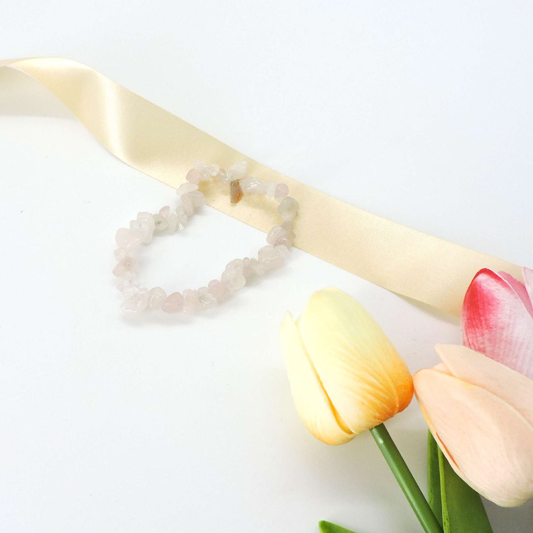 Rose Quartz Crystal Chip Bracelet with delicate, natural crystal chips, promoting self-love and emotional healing, perfect as a meaningful gift or personal accessory.