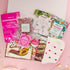 Luxury gift for her with bath salts, firming face mask, Galaxy chocolate, herbal tea, pamper socks, coconut hand mask, and more – self care in a box.